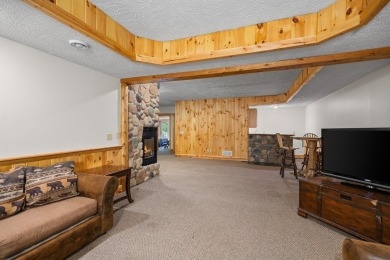 Stunning, custom-built log home overlooking the 16th tee & on Cedar River Golf Course in Michigan - for sale on GolfHomes.com, golf home, golf lot