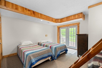 Stunning, custom-built log home overlooking the 16th tee & on Cedar River Golf Course in Michigan - for sale on GolfHomes.com, golf home, golf lot
