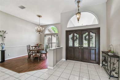 Stunning 4BR/2.5BA pool home on an oversized lot in the gated on East Lake Woodlands Country Club in Florida - for sale on GolfHomes.com, golf home, golf lot
