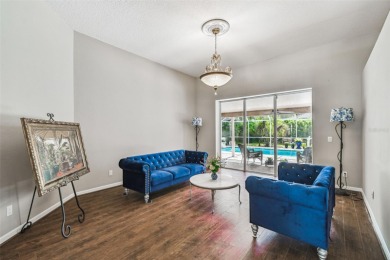 Stunning 4BR/2.5BA pool home on an oversized lot in the gated on East Lake Woodlands Country Club in Florida - for sale on GolfHomes.com, golf home, golf lot