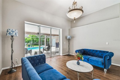 Stunning 4BR/2.5BA pool home on an oversized lot in the gated on East Lake Woodlands Country Club in Florida - for sale on GolfHomes.com, golf home, golf lot