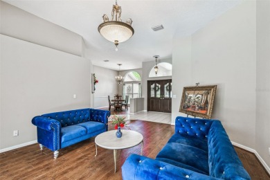 Stunning 4BR/2.5BA pool home on an oversized lot in the gated on East Lake Woodlands Country Club in Florida - for sale on GolfHomes.com, golf home, golf lot