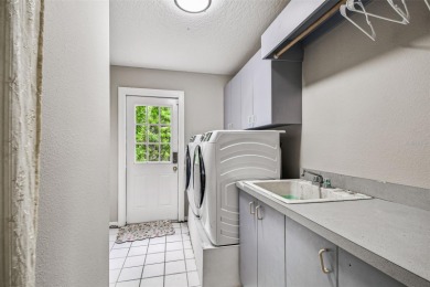 Stunning 4BR/2.5BA pool home on an oversized lot in the gated on East Lake Woodlands Country Club in Florida - for sale on GolfHomes.com, golf home, golf lot