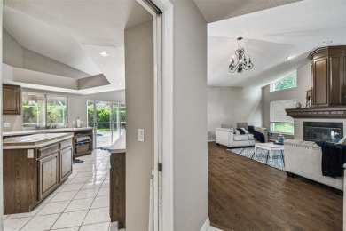 Stunning 4BR/2.5BA pool home on an oversized lot in the gated on East Lake Woodlands Country Club in Florida - for sale on GolfHomes.com, golf home, golf lot