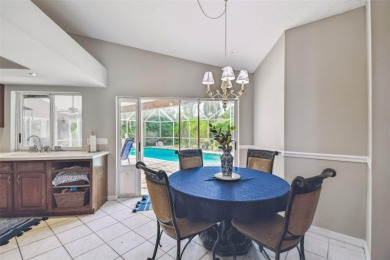 Stunning 4BR/2.5BA pool home on an oversized lot in the gated on East Lake Woodlands Country Club in Florida - for sale on GolfHomes.com, golf home, golf lot
