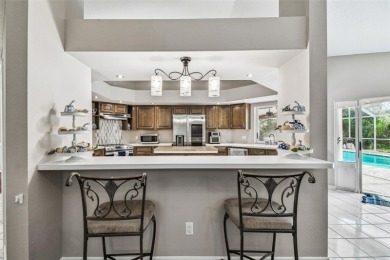 Stunning 4BR/2.5BA pool home on an oversized lot in the gated on East Lake Woodlands Country Club in Florida - for sale on GolfHomes.com, golf home, golf lot