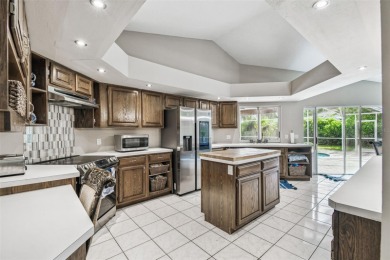 Stunning 4BR/2.5BA pool home on an oversized lot in the gated on East Lake Woodlands Country Club in Florida - for sale on GolfHomes.com, golf home, golf lot