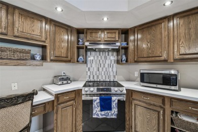 Stunning 4BR/2.5BA pool home on an oversized lot in the gated on East Lake Woodlands Country Club in Florida - for sale on GolfHomes.com, golf home, golf lot