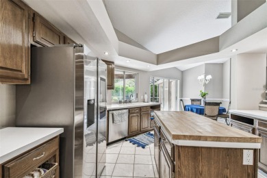 Stunning 4BR/2.5BA pool home on an oversized lot in the gated on East Lake Woodlands Country Club in Florida - for sale on GolfHomes.com, golf home, golf lot