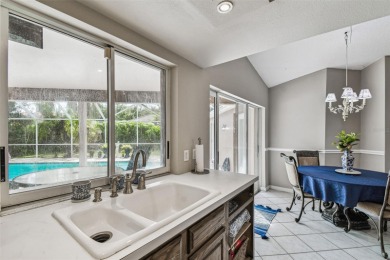 Stunning 4BR/2.5BA pool home on an oversized lot in the gated on East Lake Woodlands Country Club in Florida - for sale on GolfHomes.com, golf home, golf lot