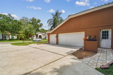 Stunning 4BR/2.5BA pool home on an oversized lot in the gated on East Lake Woodlands Country Club in Florida - for sale on GolfHomes.com, golf home, golf lot