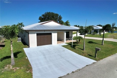 Easy Life. Lasting Style. Nearly new concrete block home in a on Spanish Lakes Country Club in Florida - for sale on GolfHomes.com, golf home, golf lot