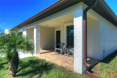 Easy Life. Lasting Style. Nearly new concrete block home in a on Spanish Lakes Country Club in Florida - for sale on GolfHomes.com, golf home, golf lot