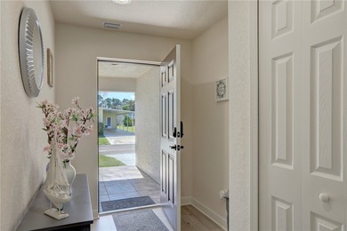 Easy Life. Lasting Style. Nearly new concrete block home in a on Spanish Lakes Country Club in Florida - for sale on GolfHomes.com, golf home, golf lot