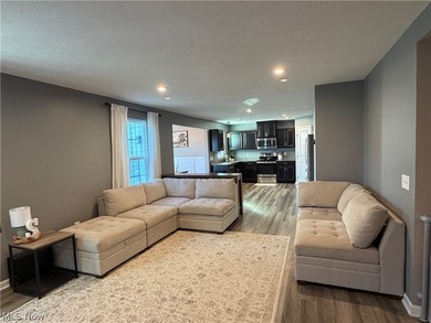 Welcome to your dream home! Tucked away in a charming cul-de-sac on Grey Hawk Golf Club in Ohio - for sale on GolfHomes.com, golf home, golf lot