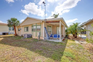 This charming 2-bedroom, 2-bathroom home is situated on a on Maple Leaf Golf and Country Club in Florida - for sale on GolfHomes.com, golf home, golf lot