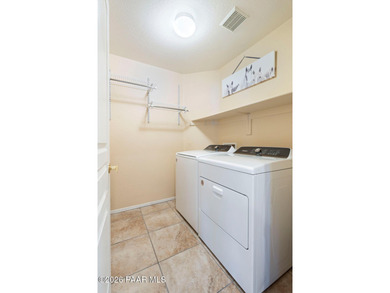 Tucked within the gated Prescott Lakes community and perfectly on Prescott Lakes Golf and Country Club in Arizona - for sale on GolfHomes.com, golf home, golf lot