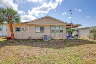 This charming 2-bedroom, 2-bathroom home is situated on a on Maple Leaf Golf and Country Club in Florida - for sale on GolfHomes.com, golf home, golf lot