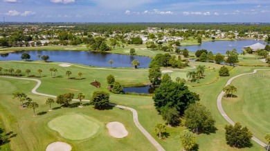 This charming 2-bedroom, 2-bathroom home is situated on a on Maple Leaf Golf and Country Club in Florida - for sale on GolfHomes.com, golf home, golf lot