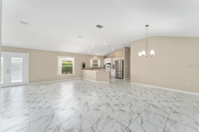 This may be the DESIGNER Concrete Block home priced under $400K on Pelican and Heron Golf Course in Florida - for sale on GolfHomes.com, golf home, golf lot