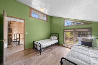 Experience the best of cabin comfort and modern design in this on Voyager Village Country Club - Voyager in Wisconsin - for sale on GolfHomes.com, golf home, golf lot