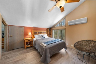 Experience the best of cabin comfort and modern design in this on Voyager Village Country Club - Voyager in Wisconsin - for sale on GolfHomes.com, golf home, golf lot