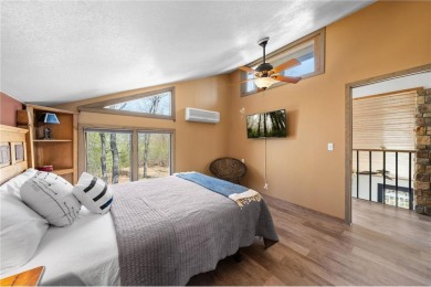 Experience the best of cabin comfort and modern design in this on Voyager Village Country Club - Voyager in Wisconsin - for sale on GolfHomes.com, golf home, golf lot