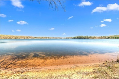 Experience the best of cabin comfort and modern design in this on Voyager Village Country Club - Voyager in Wisconsin - for sale on GolfHomes.com, golf home, golf lot
