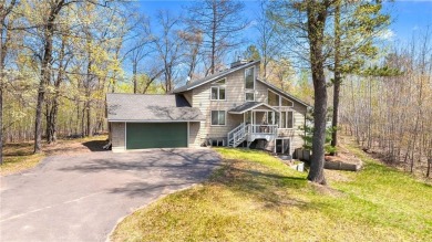 Experience the best of cabin comfort and modern design in this on Voyager Village Country Club - Voyager in Wisconsin - for sale on GolfHomes.com, golf home, golf lot