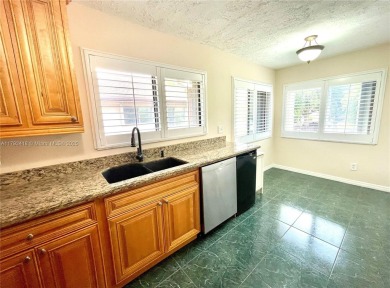 Discover this beautifully upgraded 2-bedroom, 2-bath corner unit on Pine Island Ridge Country Club in Florida - for sale on GolfHomes.com, golf home, golf lot