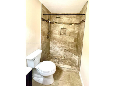 Discover this beautifully upgraded 2-bedroom, 2-bath corner unit on Pine Island Ridge Country Club in Florida - for sale on GolfHomes.com, golf home, golf lot