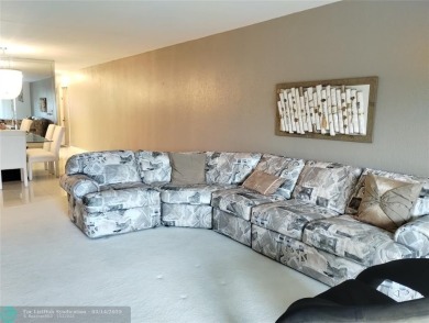 BRIGHT & SPACIOUS CORNER OVERLOOKING THE POOL AREA & SURROUNDING on Wynmoor Golf Course in Florida - for sale on GolfHomes.com, golf home, golf lot