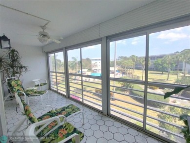 BRIGHT & SPACIOUS CORNER OVERLOOKING THE POOL AREA & SURROUNDING on Wynmoor Golf Course in Florida - for sale on GolfHomes.com, golf home, golf lot