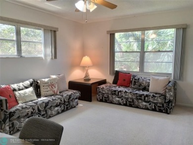 BRIGHT & SPACIOUS CORNER OVERLOOKING THE POOL AREA & SURROUNDING on Wynmoor Golf Course in Florida - for sale on GolfHomes.com, golf home, golf lot