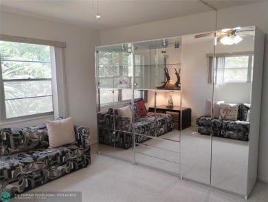 BRIGHT & SPACIOUS CORNER OVERLOOKING THE POOL AREA & SURROUNDING on Wynmoor Golf Course in Florida - for sale on GolfHomes.com, golf home, golf lot