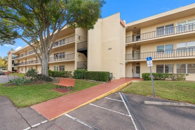 This First level condo will allow you to walk out to the on Largo Golf Course in Florida - for sale on GolfHomes.com, golf home, golf lot