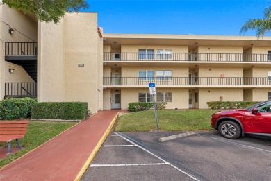 This First level condo will allow you to walk out to the on Largo Golf Course in Florida - for sale on GolfHomes.com, golf home, golf lot