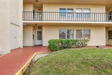 This First level condo will allow you to walk out to the on Largo Golf Course in Florida - for sale on GolfHomes.com, golf home, golf lot