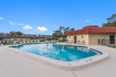 This First level condo will allow you to walk out to the on Largo Golf Course in Florida - for sale on GolfHomes.com, golf home, golf lot