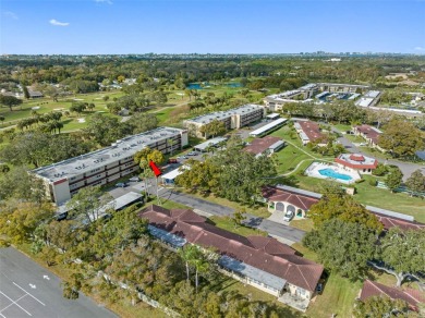 This First level condo will allow you to walk out to the on Largo Golf Course in Florida - for sale on GolfHomes.com, golf home, golf lot