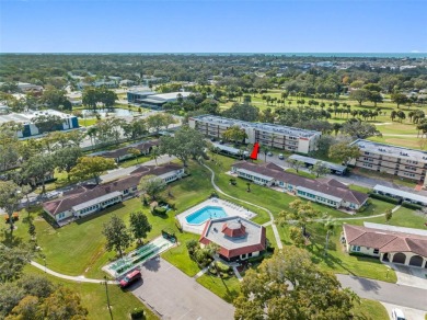 This First level condo will allow you to walk out to the on Largo Golf Course in Florida - for sale on GolfHomes.com, golf home, golf lot