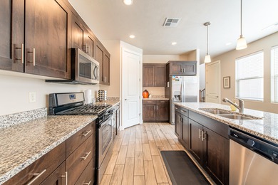 This stunning home is located in the highly sought-after on Entrada at Snow Canyon in Utah - for sale on GolfHomes.com, golf home, golf lot