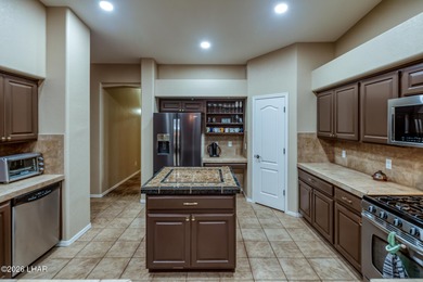 Welcome to this beautifully appointed retreat on a 1/3 acre lot on London Bridge Golf Course in Arizona - for sale on GolfHomes.com, golf home, golf lot