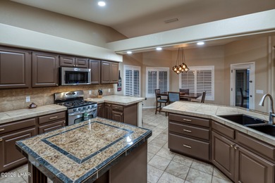 Welcome to this beautifully appointed retreat on a 1/3 acre lot on London Bridge Golf Course in Arizona - for sale on GolfHomes.com, golf home, golf lot