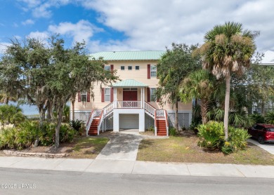 Located on the serene salt marsh with sweeping deep-water views on Ocean Creek Golf Course in South Carolina - for sale on GolfHomes.com, golf home, golf lot