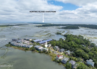 Located on the serene salt marsh with sweeping deep-water views on Ocean Creek Golf Course in South Carolina - for sale on GolfHomes.com, golf home, golf lot