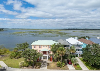 Located on the serene salt marsh with sweeping deep-water views on Ocean Creek Golf Course in South Carolina - for sale on GolfHomes.com, golf home, golf lot