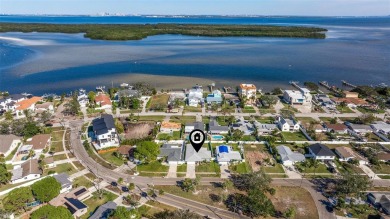 Welcome to your dream home, perfectly situated just moments from on Mangrove Bay Golf Course in Florida - for sale on GolfHomes.com, golf home, golf lot