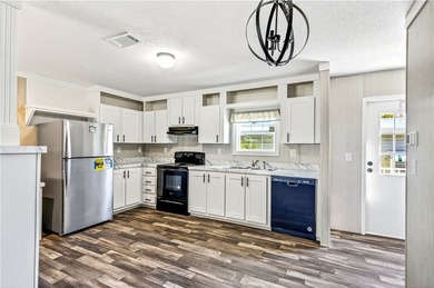 Start fresh in Barefoot Bay! This brand new manufactured home is on Barefoot Bay Golf Course in Florida - for sale on GolfHomes.com, golf home, golf lot