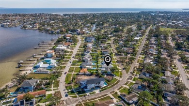 Welcome to your dream home, perfectly situated just moments from on Mangrove Bay Golf Course in Florida - for sale on GolfHomes.com, golf home, golf lot